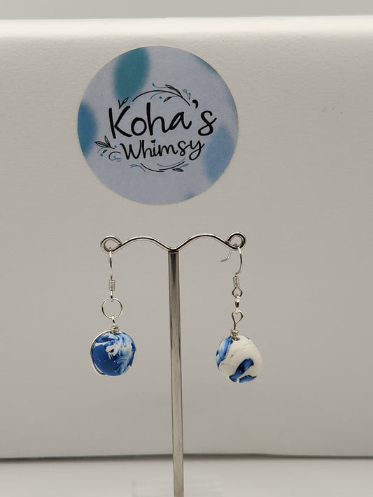 Close-up of galactic dreams set showing wire-wrapped beads and blue gradient shimmer with artisan craftsmanship