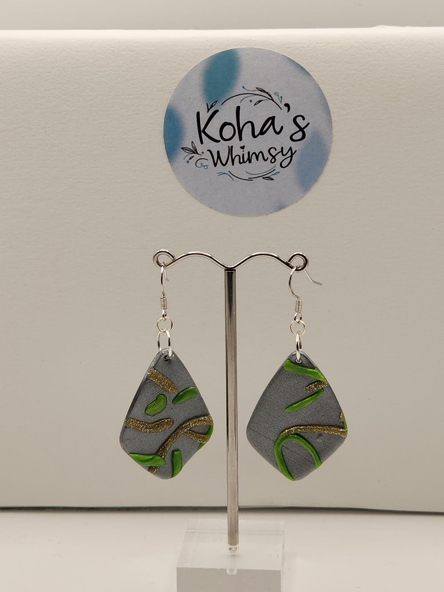 Abstract swirls polymer clay earrings showing sophisticated green and gold colour combination