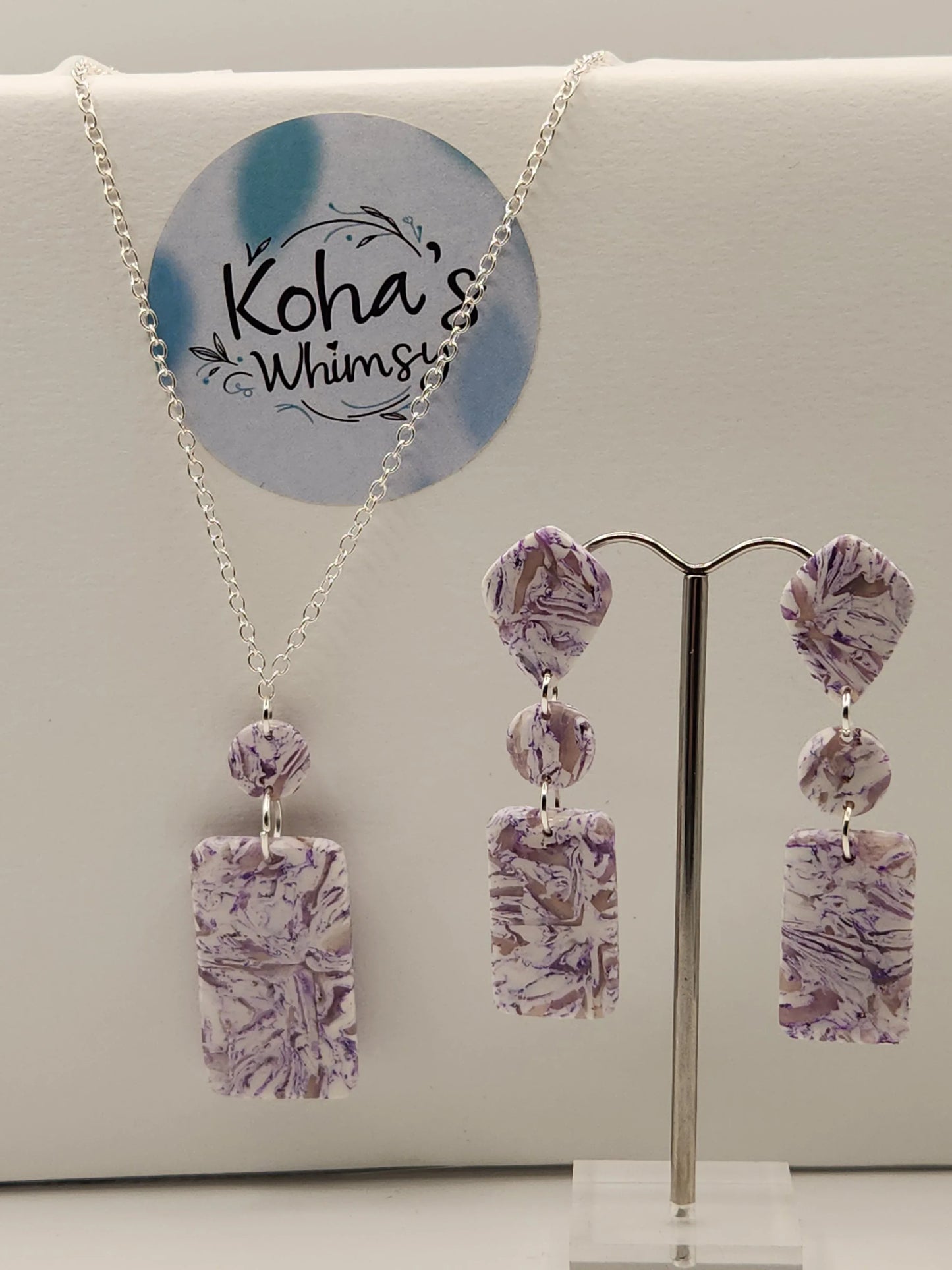 Violet howlite jewellery set by Koha's Whimsy, including a necklace and pair of earrings in geometric shapes.