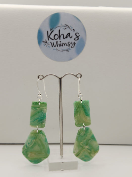 Close-up of moss agate earrings showing intricate natural stone-inspired design with earthy tones