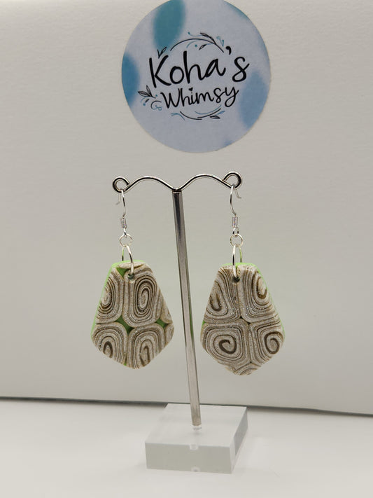 Handmade polymer clay large drop dangle earrings with vibrant lime green and cinnamon swirl design
