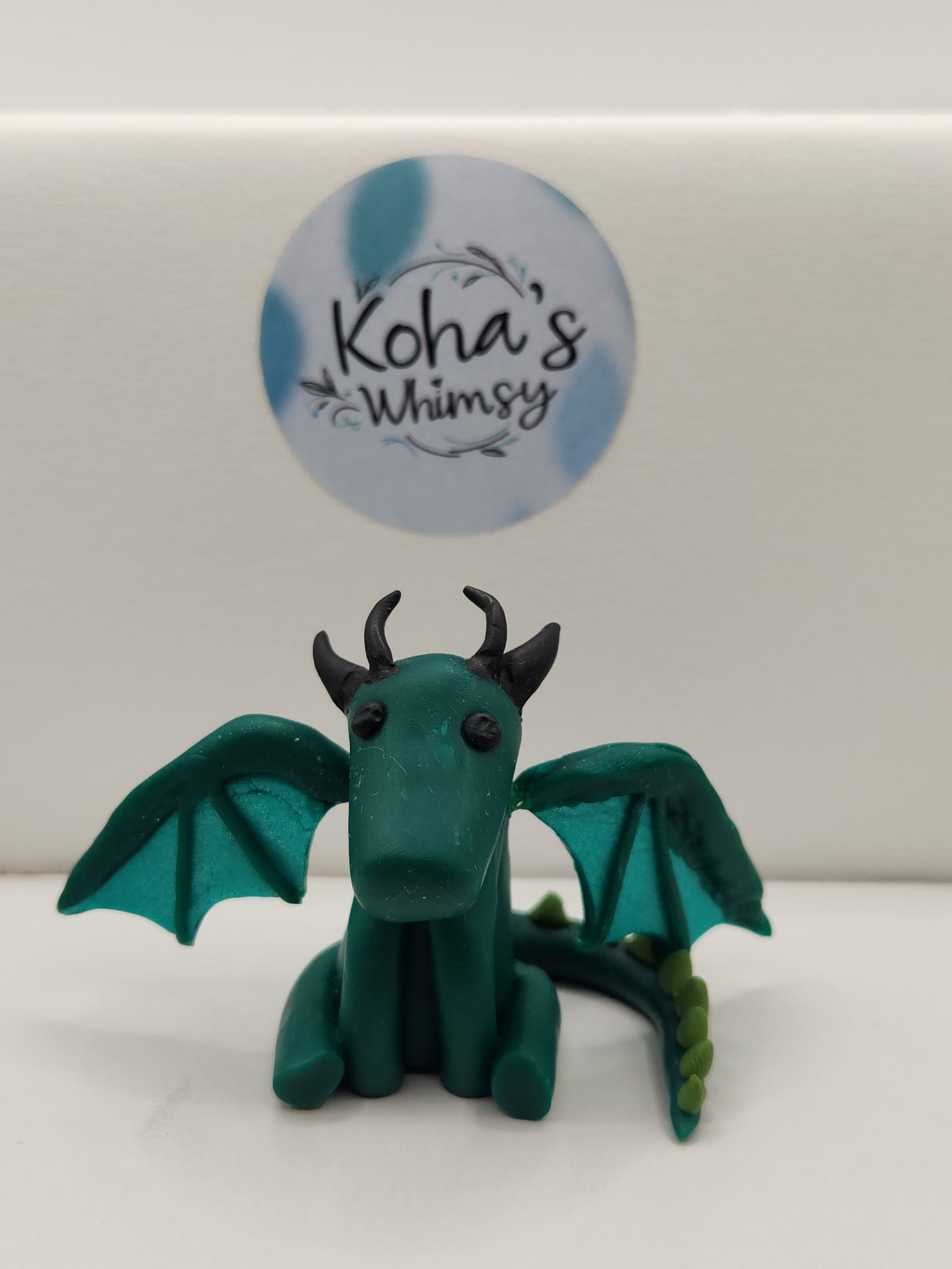 Close-up of Terrence the dragon desk friend showing detailed sculpting and colourful features