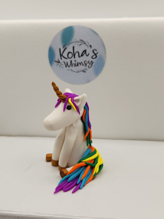 Close-up of Gally the unicorn desk friend showing detailed sculpting and colourful features