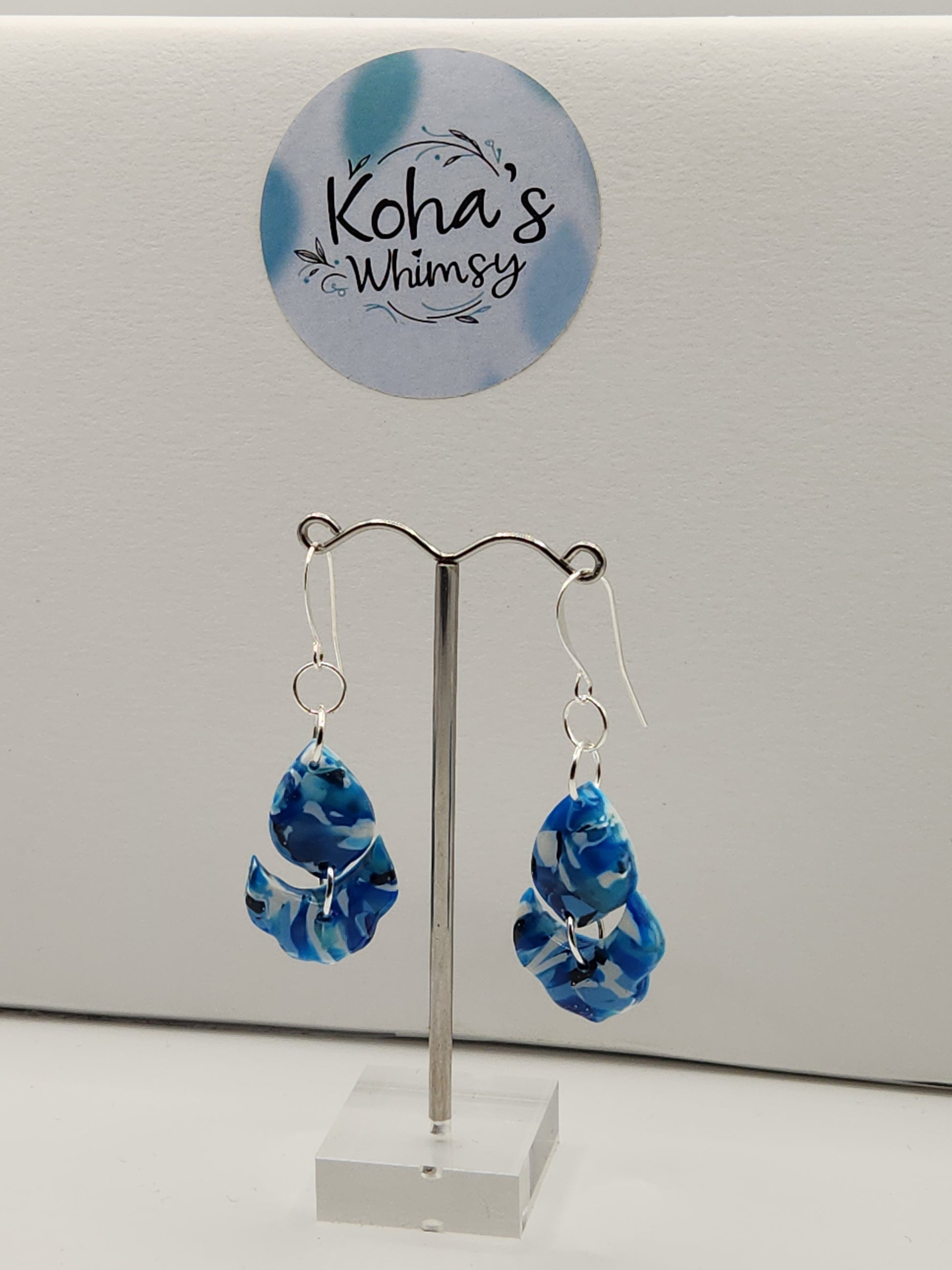 Navy burst cascading petal earrings displayed showing sophisticated floral style and lightweight design