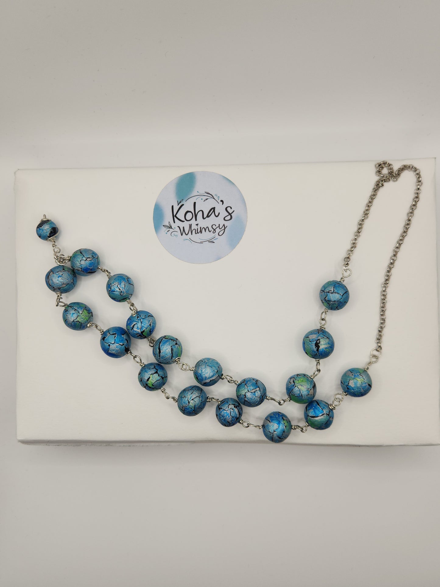 One of a kind handmade polymer clay necklace with azure blue watercolour tear-shaped beads
