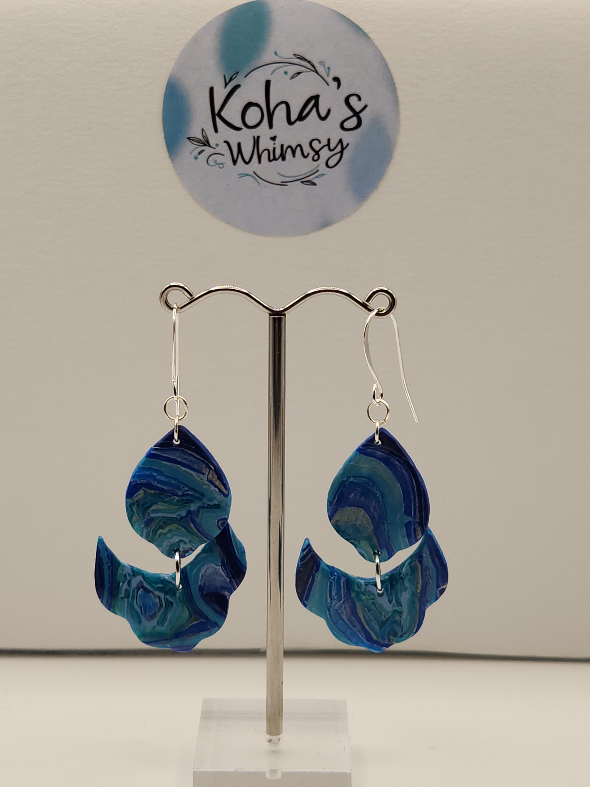 Handmade polymer clay cascading petal dangle earrings with blue agate inspired design
