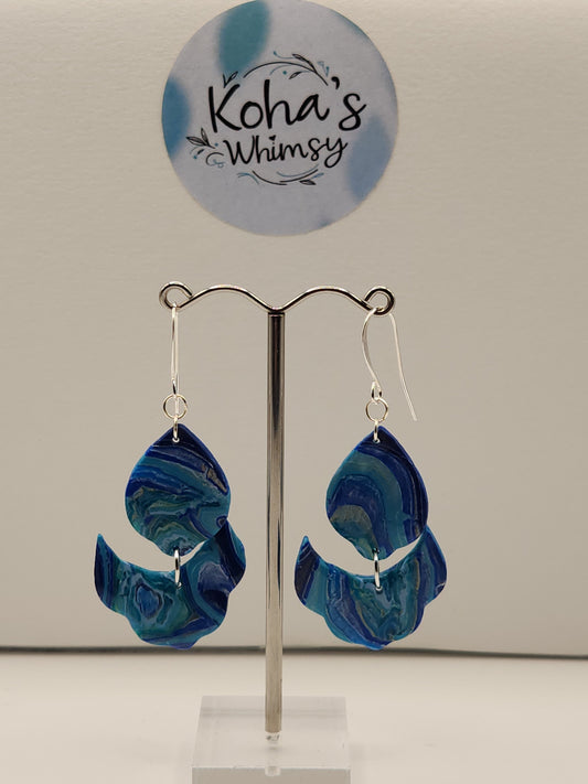 Handmade polymer clay cascading petal dangle earrings with blue agate inspired design

