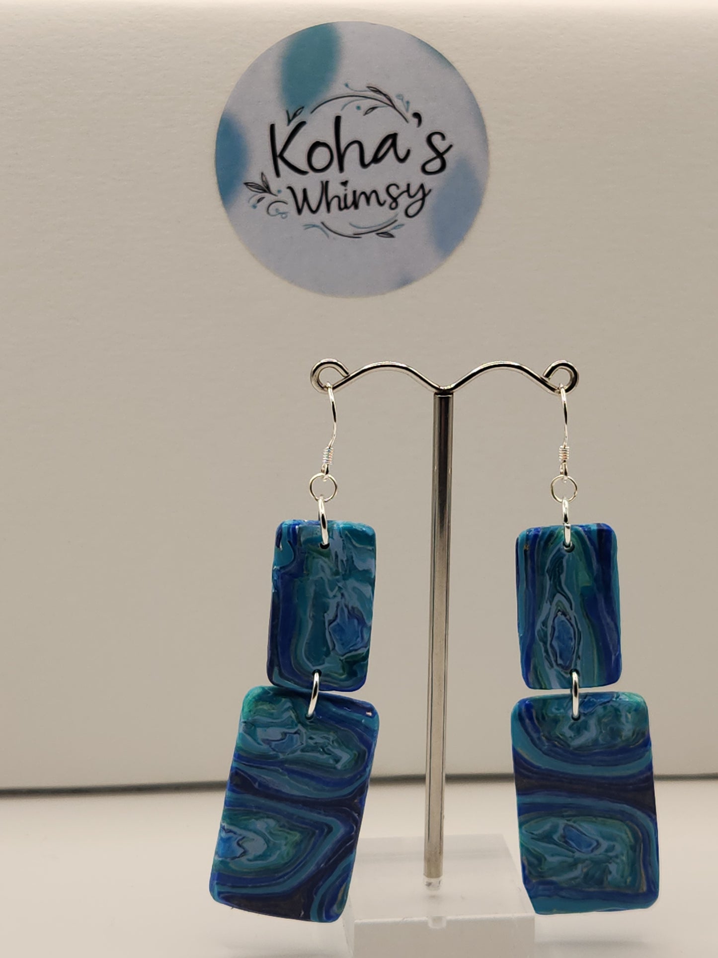 Blue agate rectangle earrings displayed showing elegant design with sterling silver hooks