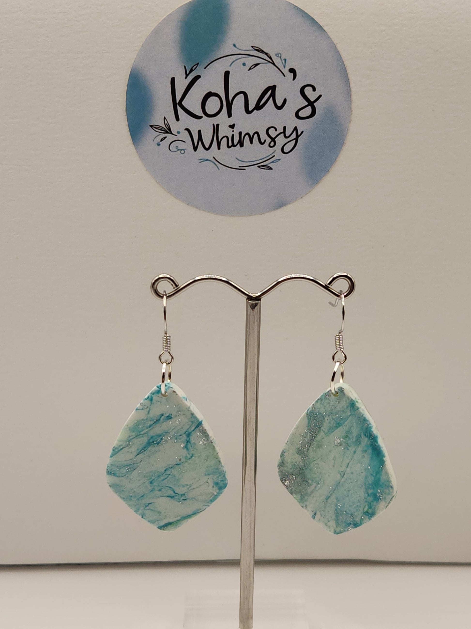 Handmade polymer clay earrings with aqua howlite turquoise marbling pattern