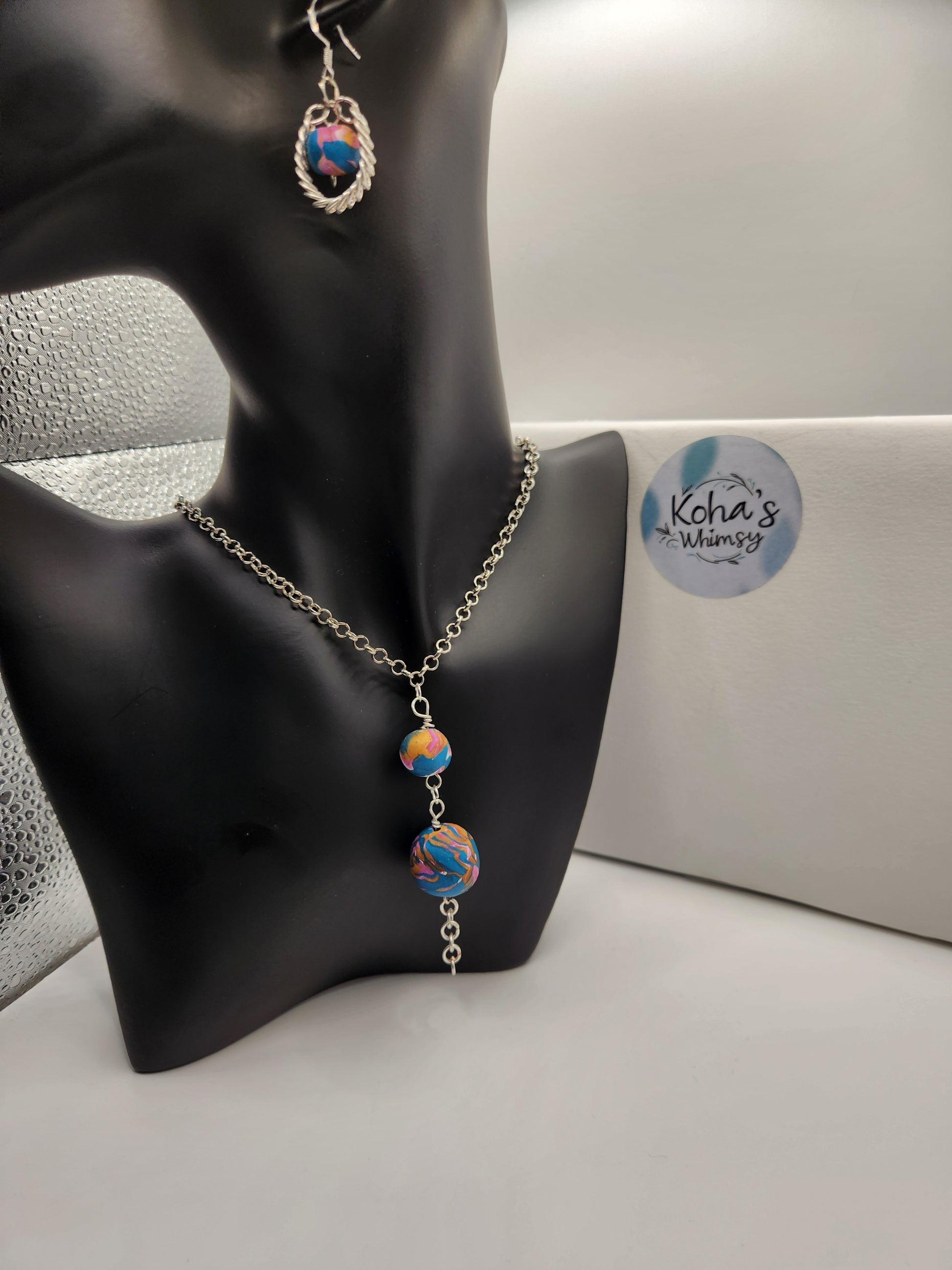 One of a kind handmade coiled wire beaded jewellery set with pink, blue and gold polymer clay beads
