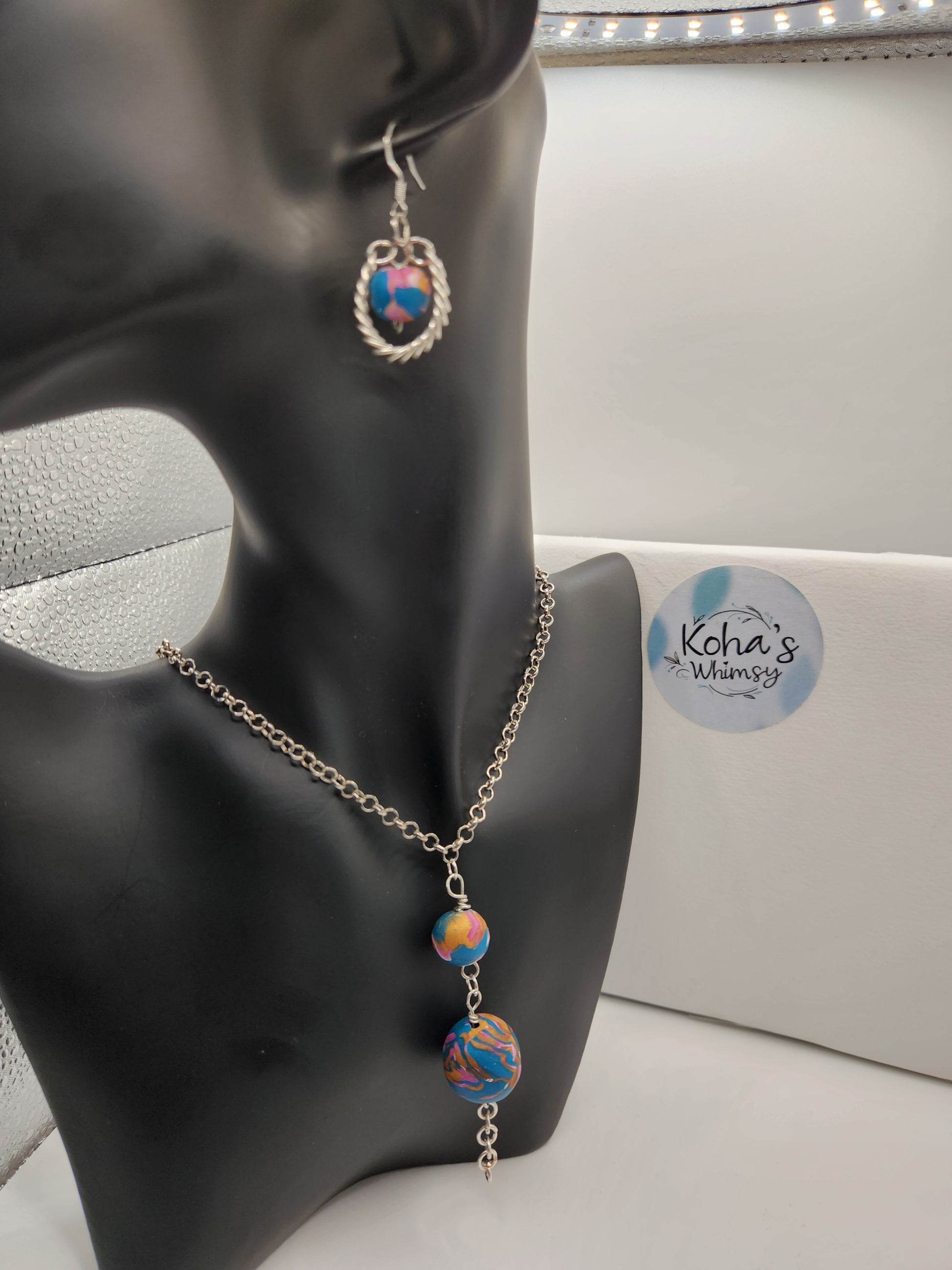 Detail of coiled wire jewellery set showing artisan craftsmanship and vibrant bead colours