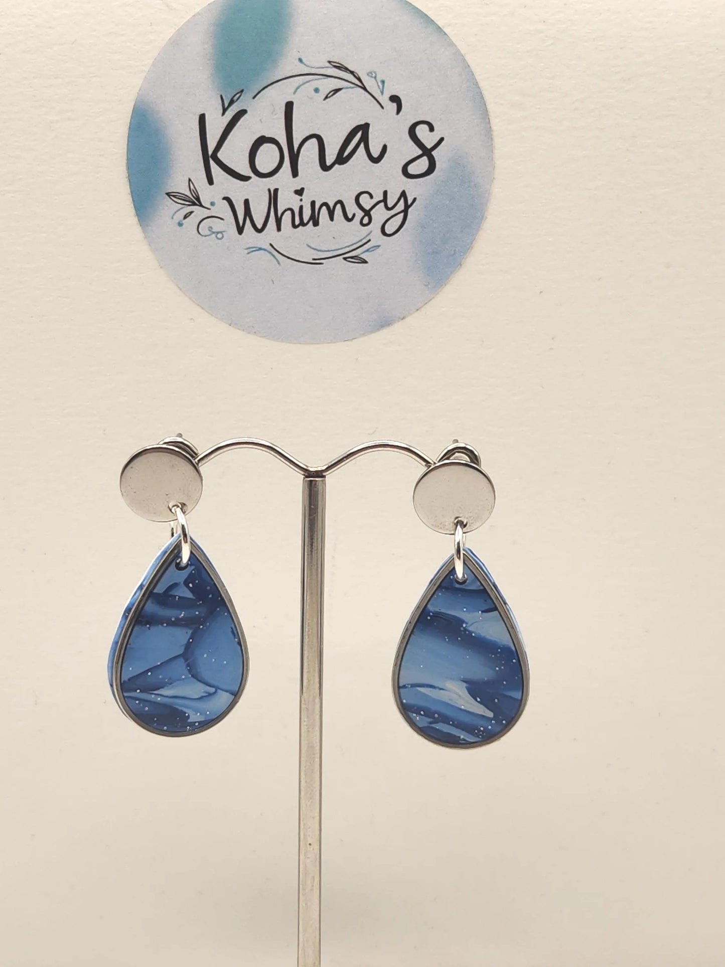 Close-up of shades of blue earrings showing elegant dangle stud design with beautiful blue gradient
