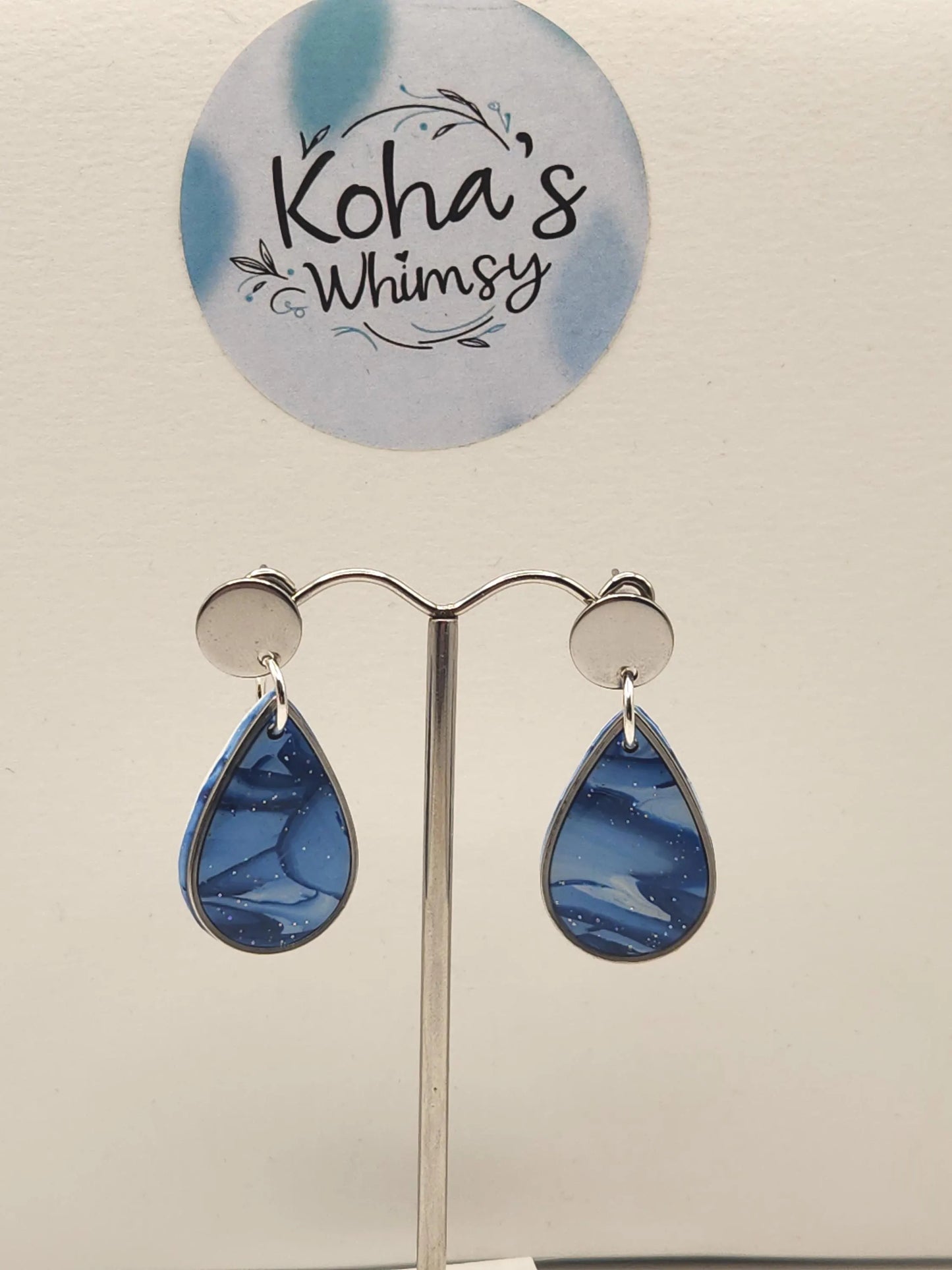 Shades of blue dangle stud earrings displayed showing versatile design perfect for casual and formal occasions