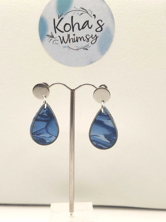 Handmade shades of blue dangle stud earrings featuring captivating gradient from deep ocean to soft sky blue tones
